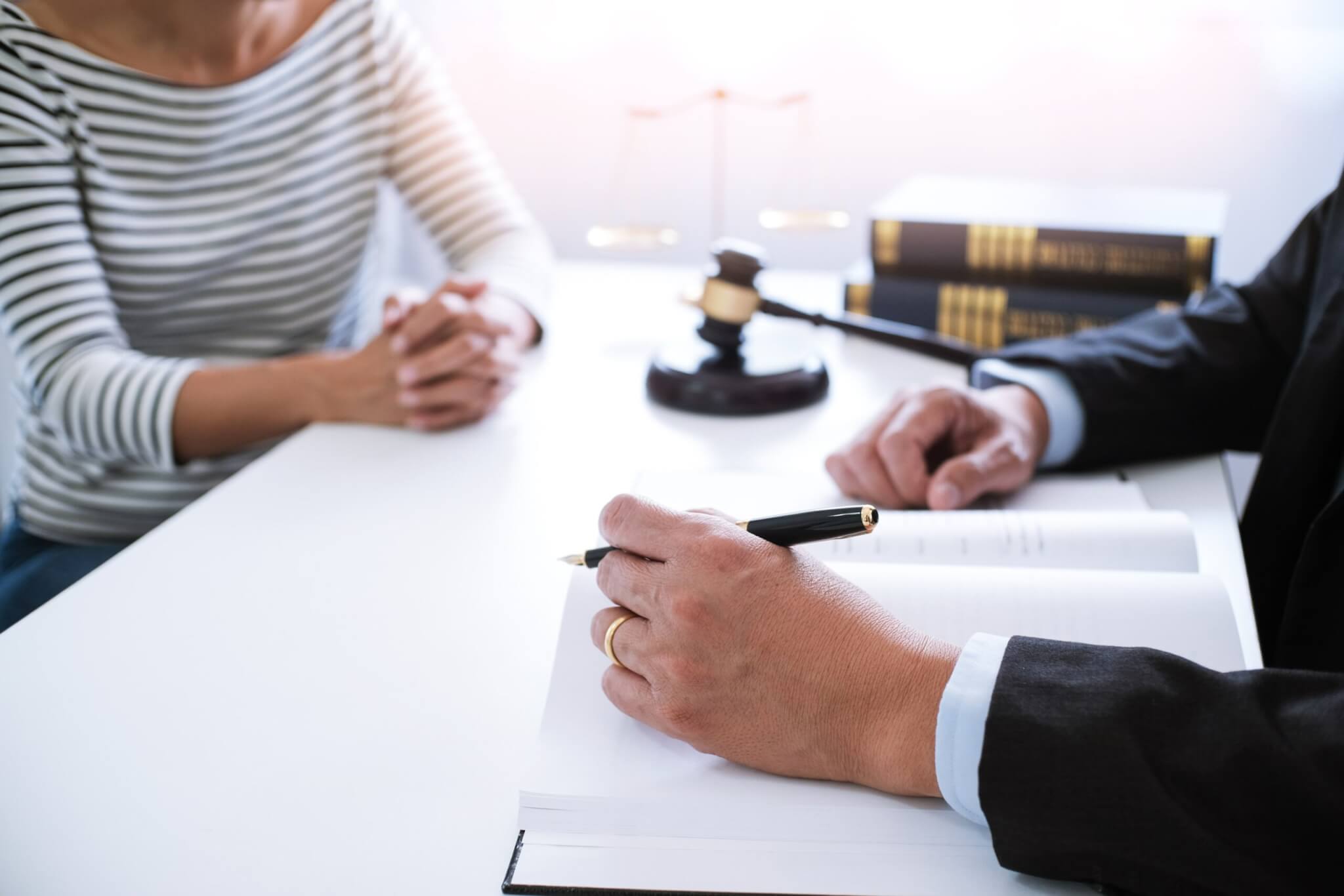Woman sitting with personal injury attorney