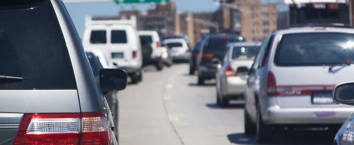 cars stuck in traffic on a highway