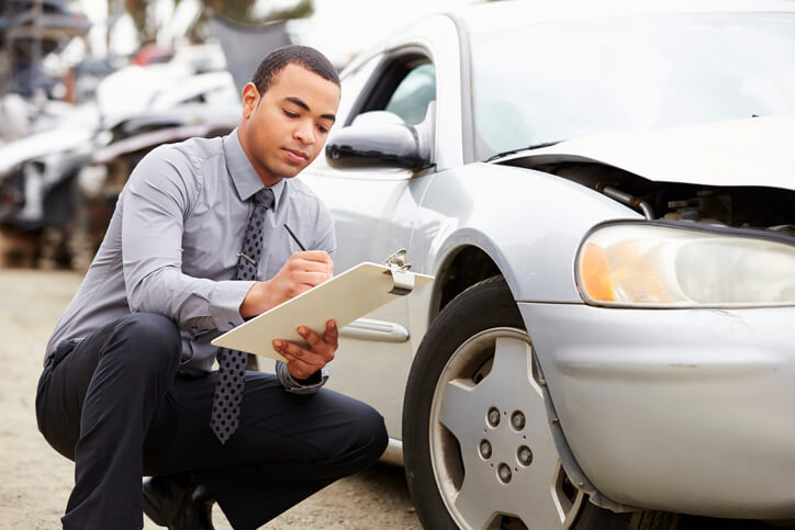 Man filling out accident form